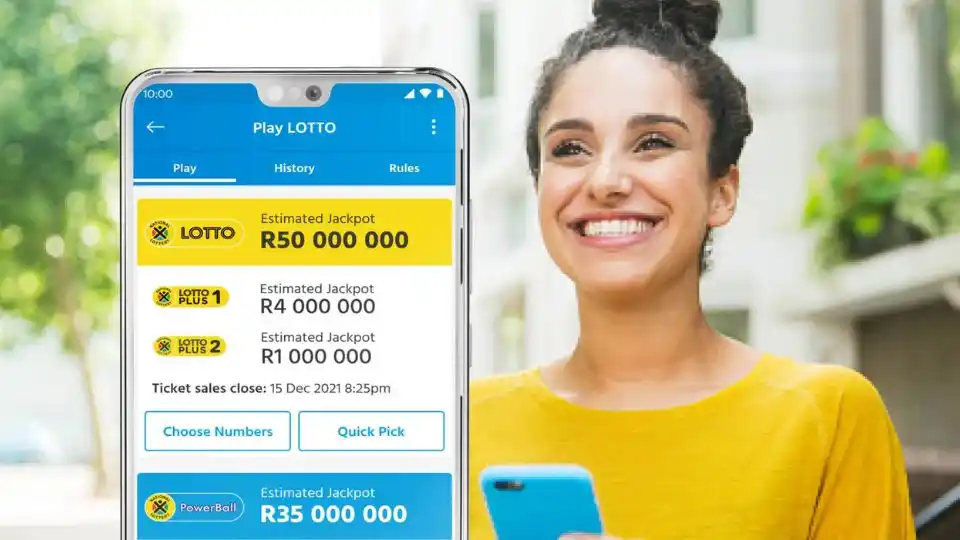 Smiling woman playing the lotto South Africa on her phone